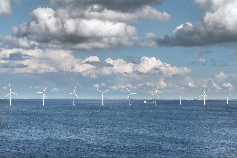 A group of wind turbines in the ocean