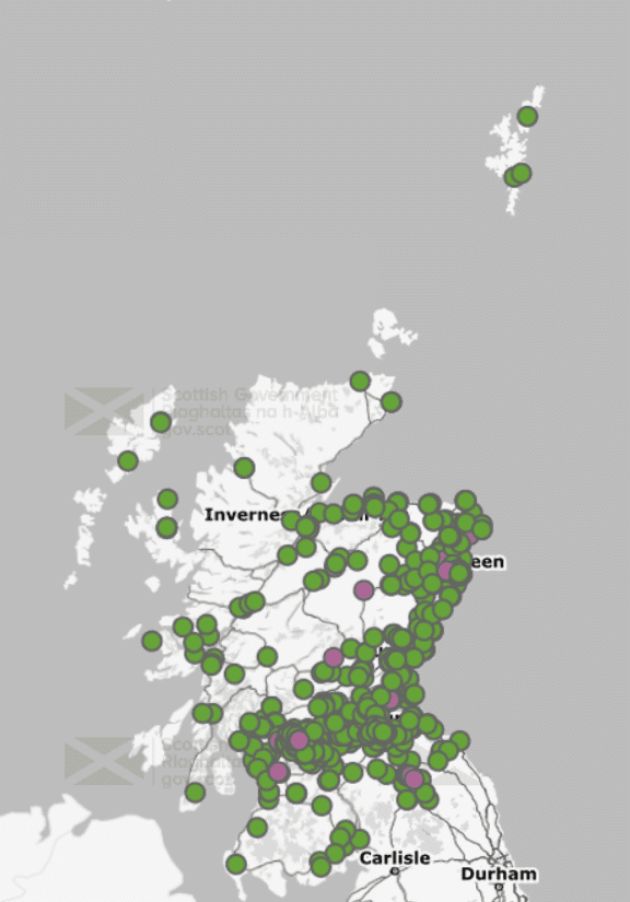 A map of Scotland covered in green and pink dots, clustered around populated areas.