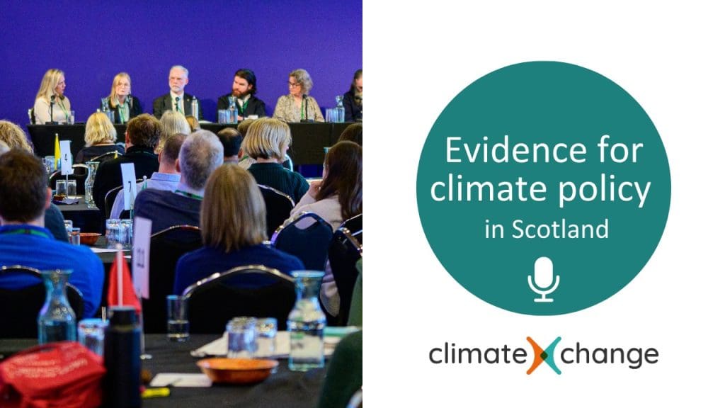 Audience seated at a conference listening to a panel discussion on stage, with several speakers at a long table against a blue backdrop. Beside the photo is a graphic reading “Evidence for climate policy in Scotland” above the ClimateXChange logo.